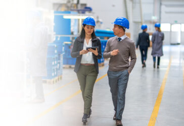 man-woman-walking-in-distribution-center